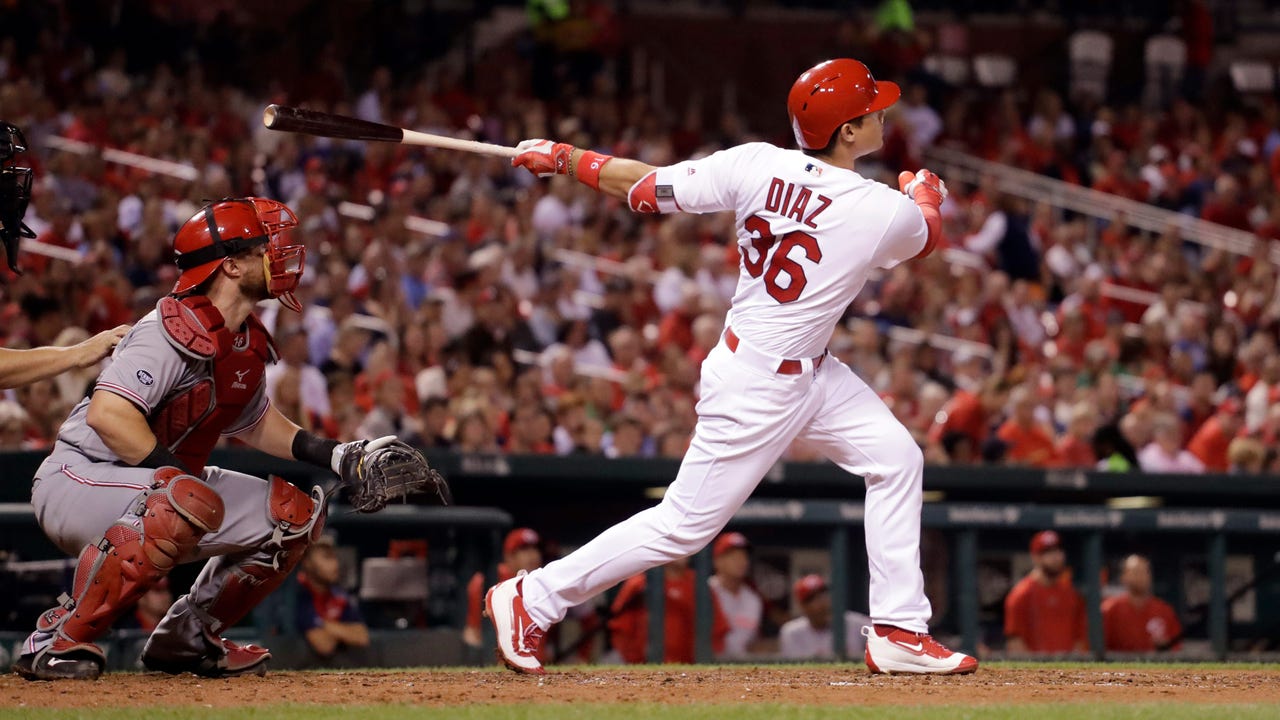 Cards power past emotions, bounce back against Reds